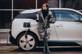 woman-charging-electro-car-at-the-street-min